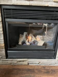 Clean glass on a gas fireplace after a cleaning